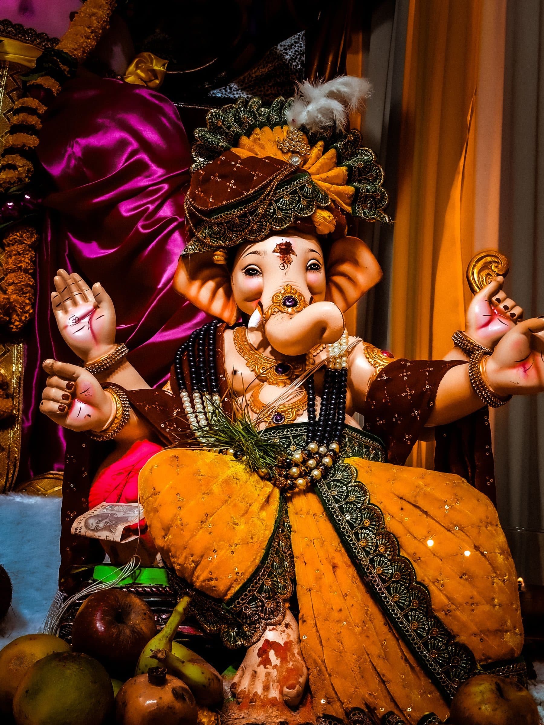 A Ganpati idol dressed in gold silk